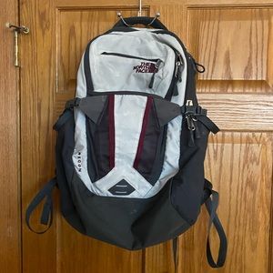 Light grey and burgundy North Face backpack